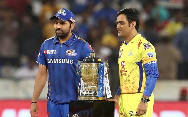 MS Dhoni and Rohit Sharma standing with the IPL Trophy