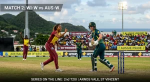 WI-W vs AUS-W 2nd T20I match action at Arnos Vale Ground, St Vincent, showing a West Indies Women bowler celebrating a wicket appeal against an Australia Women batter at the crease, with "Go Windies" and "Aussie Pride" banners visible in the crowd and the "Australia Women Tour of West Indies 2026" perimeter board in the background.