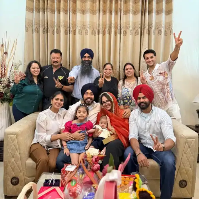 Abhishek Sharma posing with his family members during a celebration at home