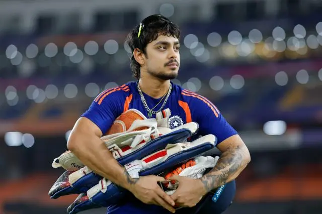 Ishan Kishan carrying batting equipment during an India cricket training session