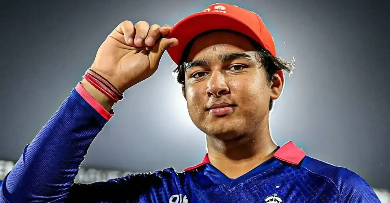 Vaibhav Sooryavanshi wears the IPL Orange Cap in a close-up portrait under stadium lights.
