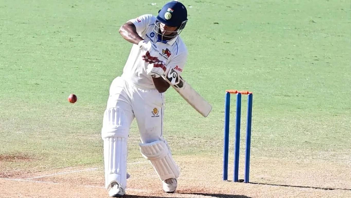 Vaibhav Sooryavanshi plays a defensive shot in white cricket kit during his Ranji Trophy debut for Bihar.
