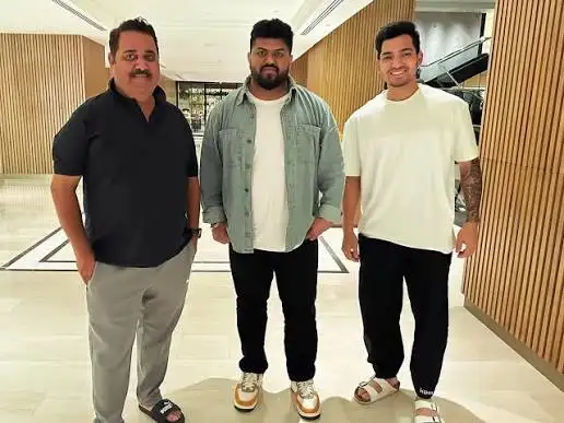 Anuj Rawat with coach Raj Kumar Sharma, reflecting the wicketkeeper-batter’s training journey at the West Delhi cricket academy.