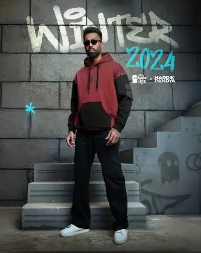 Hardik Pandya posing in casual streetwear during a fashion and brand promotion photoshoot.