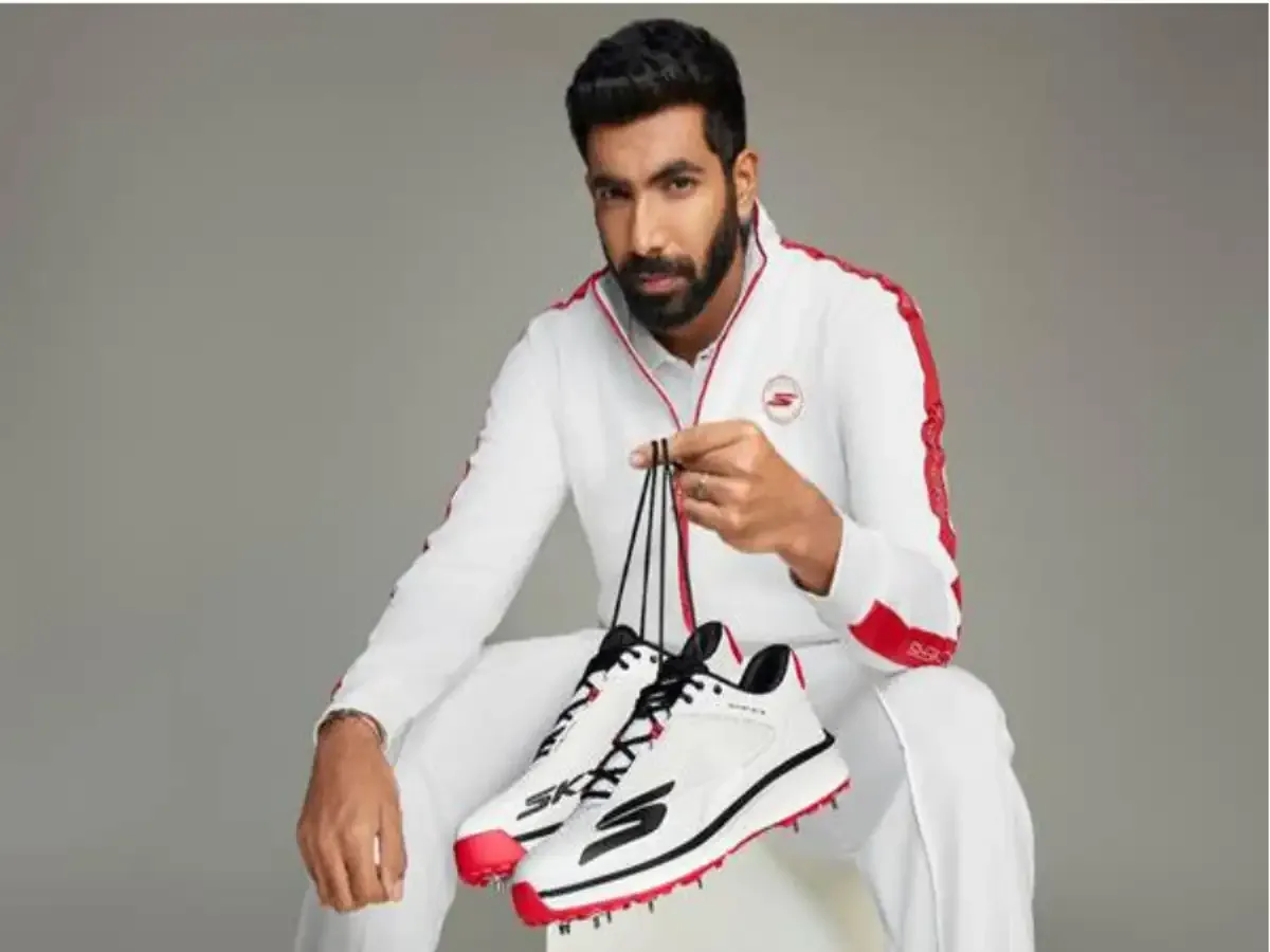 Indian fast bowler holding Skechers cricket shoes in a promotional campaign representing Jasprit Bumrah’s brand endorsements and sponsorship income.