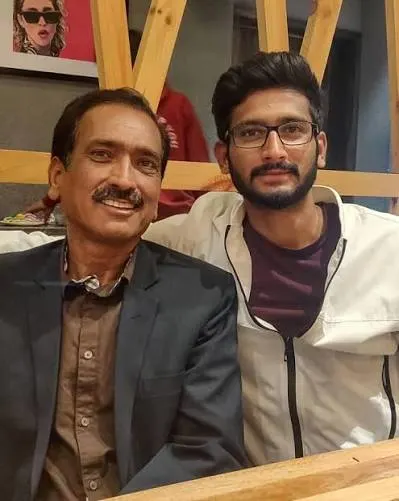 Khaleel Ahmed with his father Khursheed Ahmed in a family photo highlighting his journey from Tonk, Rajasthan, to international cricket.