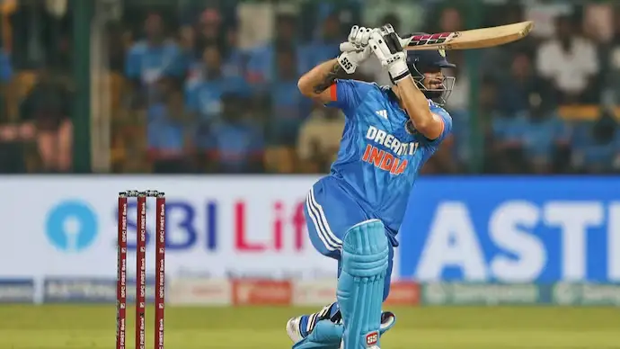 Rinku Singh playing an attacking batting shot for India during an international cricket match.