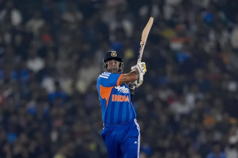 Suryakumar Yadav playing an attacking shot for India, representing his BCCI contract and international match earnings.