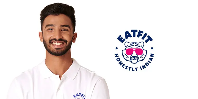 Devdutt Padikkal wearing a white EatFit polo shirt alongside the EatFit logo for his brand endorsement.