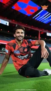 Nitish Kumar Reddy sitting on the cricket field in Sunrisers Hyderabad colours, representing his IPL breakthrough and growing importance to SRH.