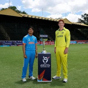India U-19 captain standing with Australia’s captain beside the ICC U-19 World Cup trophy in Benoni during the 2024 tournament