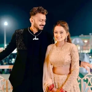 Axar Patel with his wife Meha Patel at an event, pictured together in traditional attire.