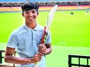 Young Devdutt Padikkal holding a cricket bat during his early cricket career
