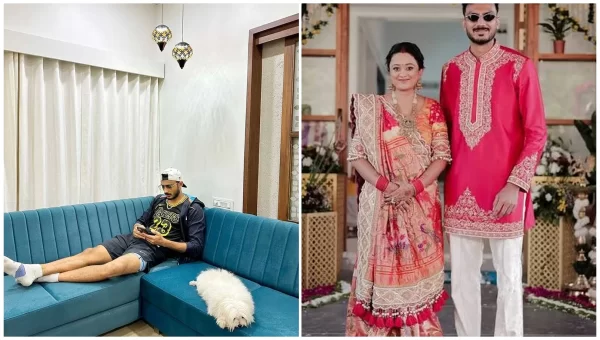 Indian cricketer relaxing inside a modern home with a pet dog alongside a traditional family photograph.