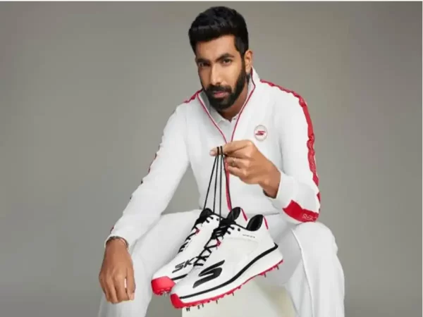 Indian fast bowler holding Skechers cricket shoes in a promotional campaign representing Jasprit Bumrah’s brand endorsements and sponsorship income.