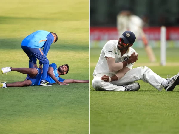 Indian fast bowler receiving treatment on the training field and later sitting on the ground while holding his injured shoulder during a Test match.