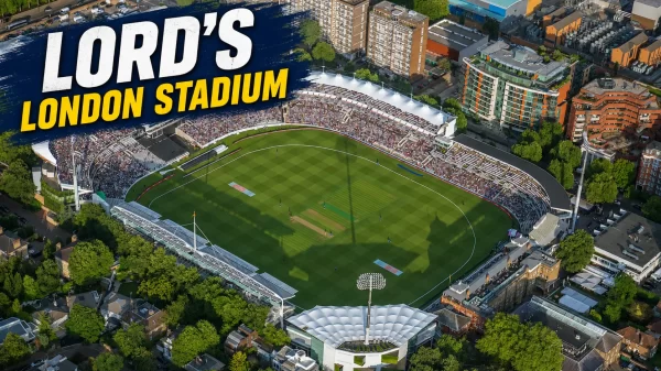 Aerial view of Lord’s Cricket Ground in London showing the cricket pitch, stands, floodlights and surrounding city buildings.