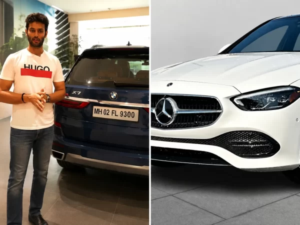 Shivam Dube pictured beside a BMW X7 with a Mercedes-Benz luxury car, representing vehicles reported in his collection.