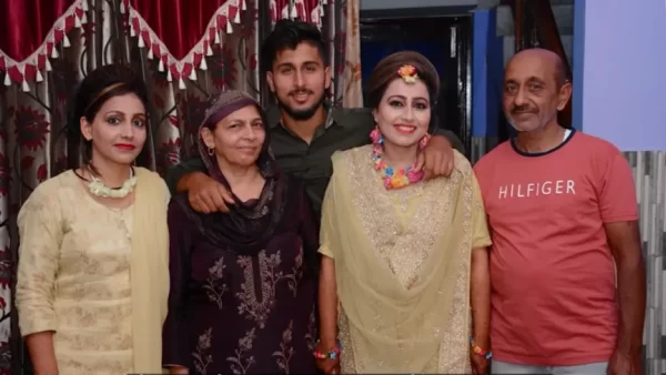 Umran Malik standing with members of his family during a celebration at their home.